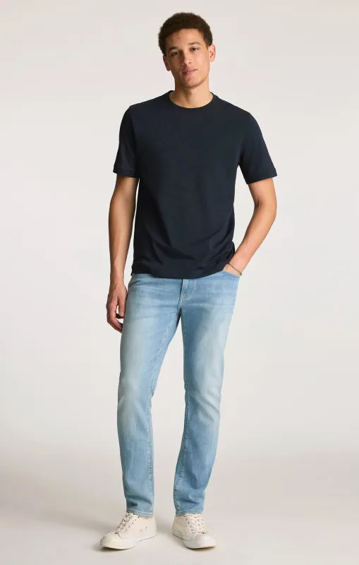 JAKE SLIM LEG IN LIGHT FOGGY FEATHER BLUE made by Mavi
