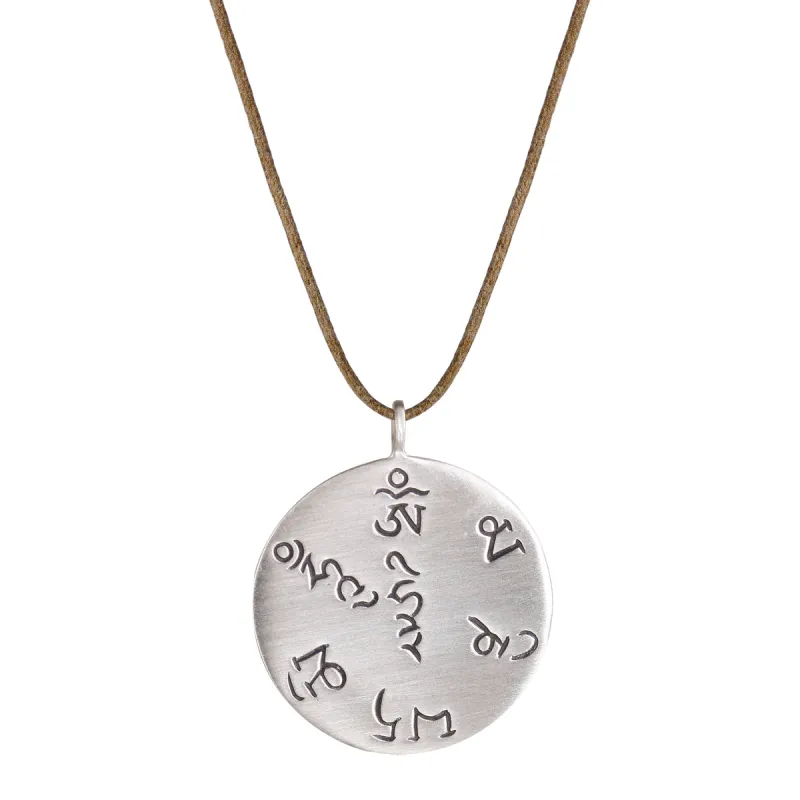 Sterling Silver Tibet Fund Pendant on Natural Cord sold by Me & Ro