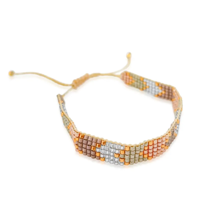 Gold and Beige Chevron Bead Bracelet sold by Meira T