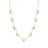 Yellow Gold and Blue Topaz Bezel Necklace sold by Meira T