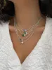 Yellow Gold Two Stoned Diamond and Emerald Necklace sold by Meira T