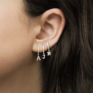 Single White Gold "O" Initial Huggie sold by Meira T