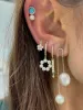 Yellow Gold and Pearl Huggies sold by Meira T