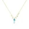 Yellow Gold Blue Topaz and Diamond Bezel Necklace sold by Meira T
