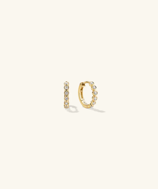 14k Gold Bezel Lab Grown Diamond Huggie Earrings - Jewelry | Mejuri sold by Mejuri