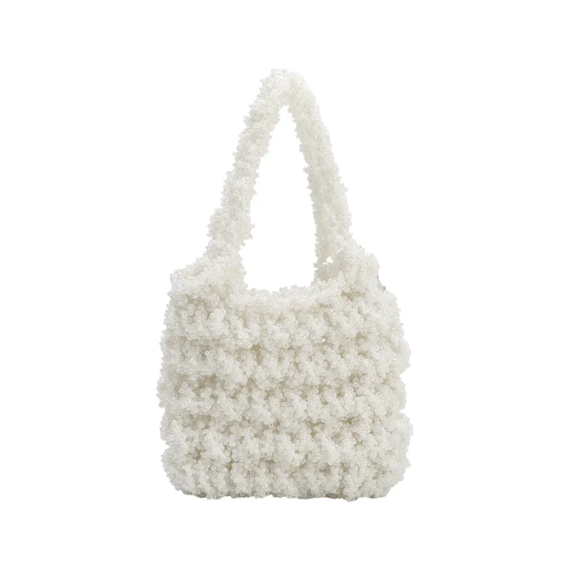 Norma Ivory Mini Beaded Crossbody Bag sold by Melie Bianco