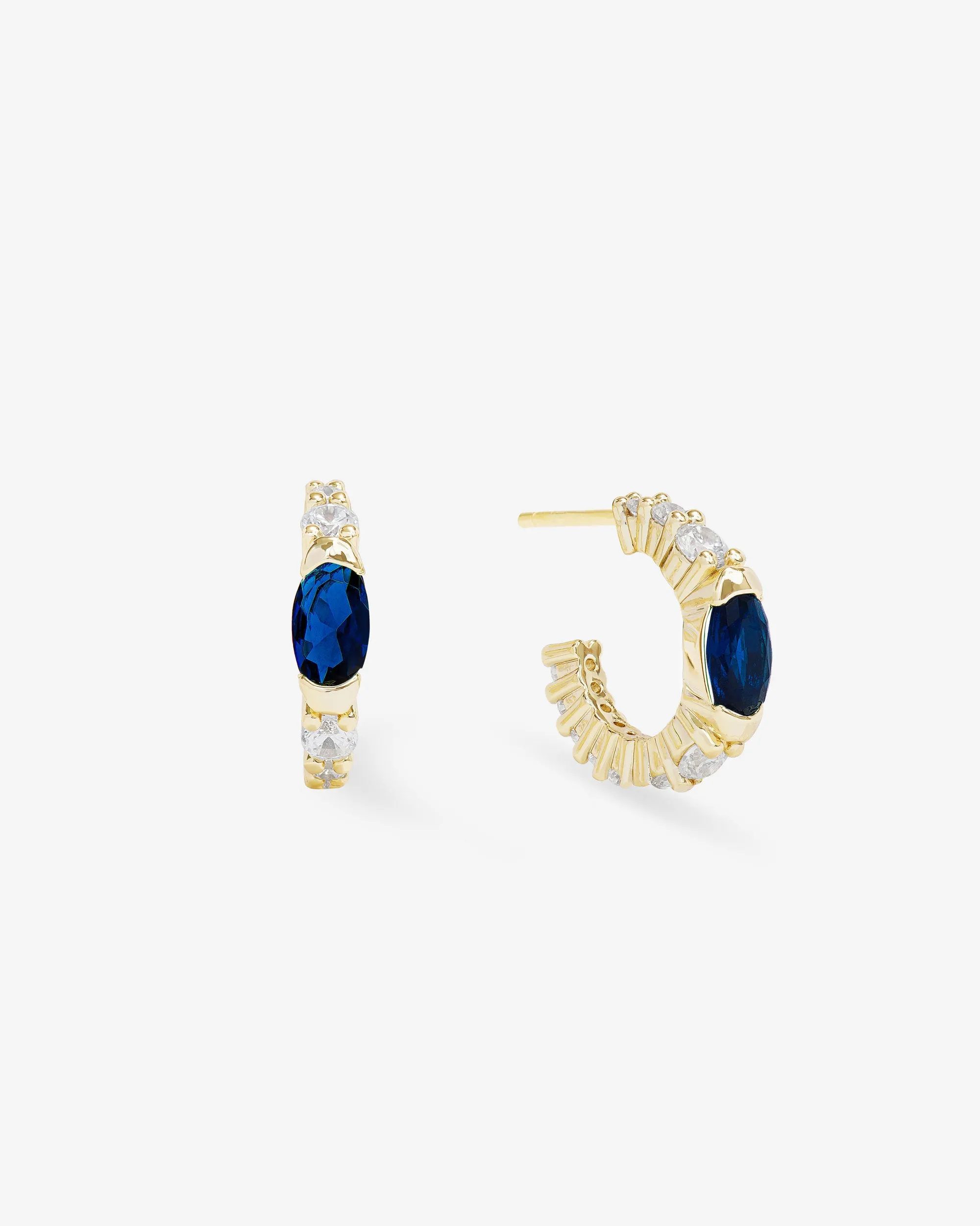 The Maven Huggies - Gold|Blue Sapphire sold by Melinda Maria