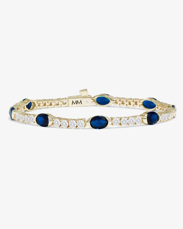 The Maven Tennis Bracelet - Gold|Blue Sapphire sold by Melinda Maria