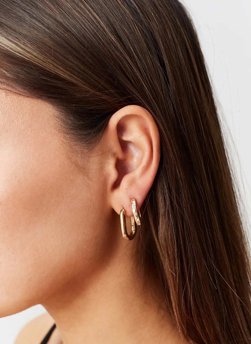 Gold Oval Hoop Huggy Earrings sold by Melissa Odabash product image thumbnail 4