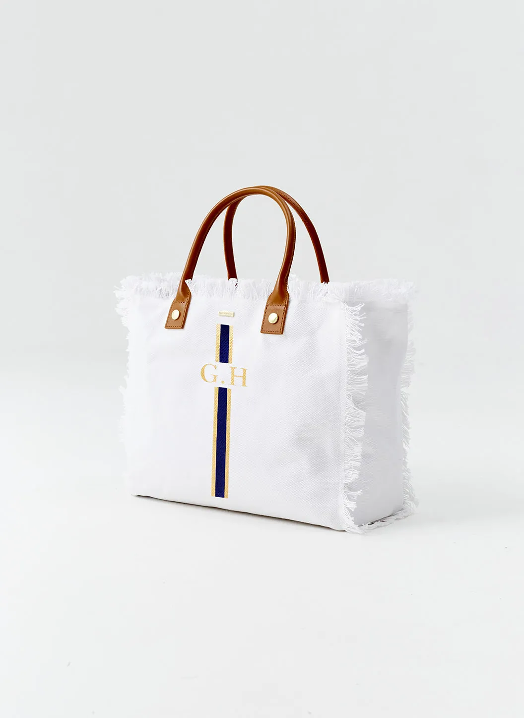 Cap Ferrat White Navy sold by Melissa Odabash