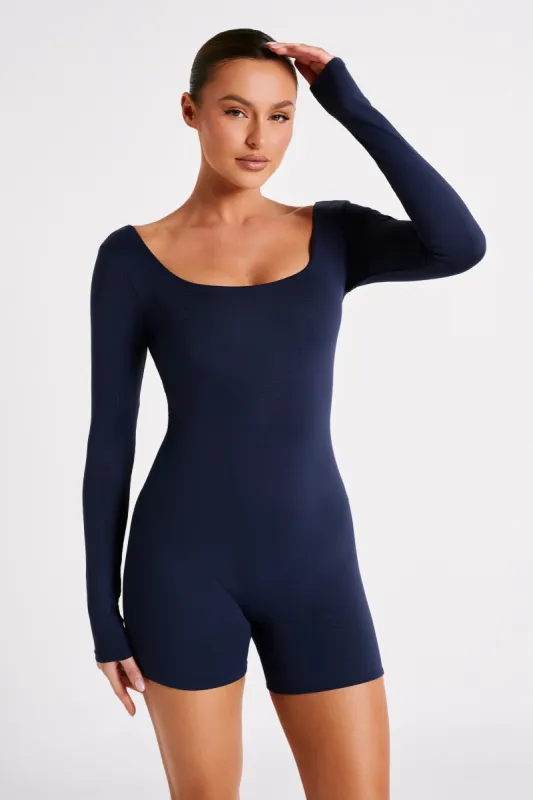 Oakley Recycled Nylon Long Sleeve Playsuit - Navy sold by Meshki