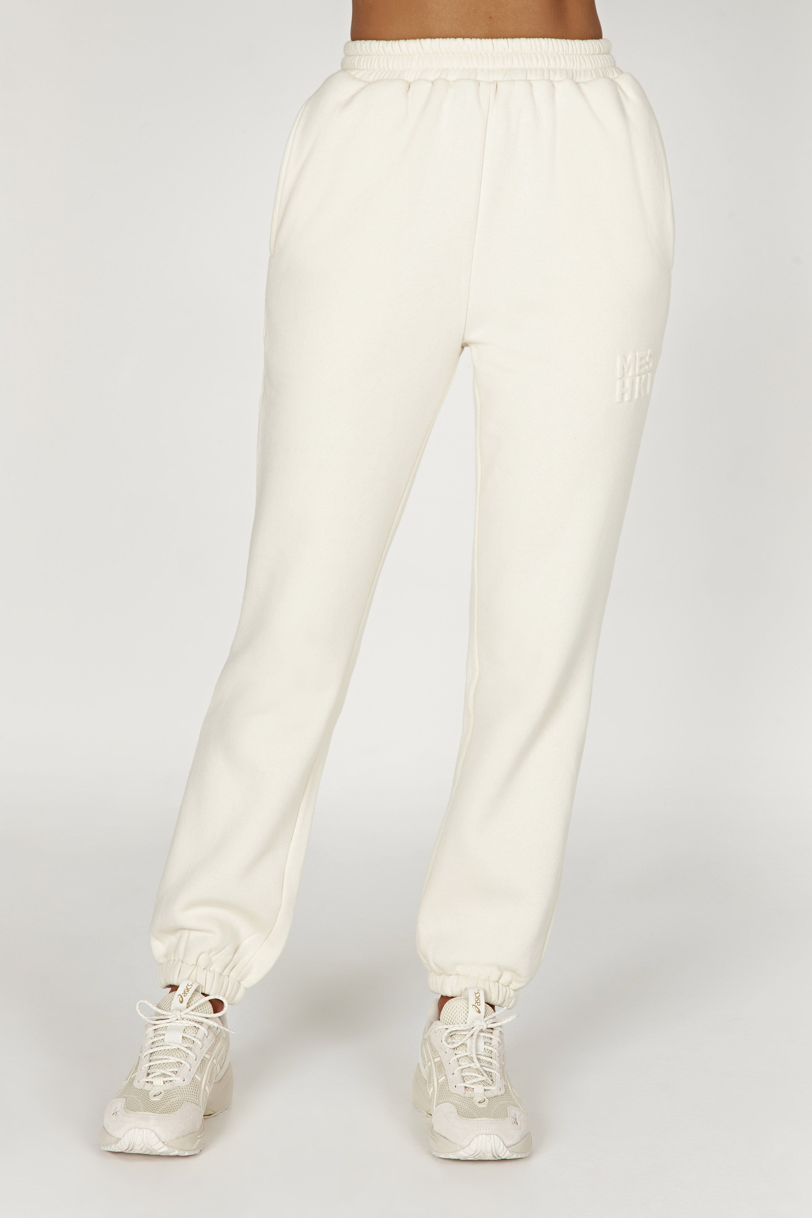 Emery Embossed Fleeceback Joggers - Bone sold by Meshki