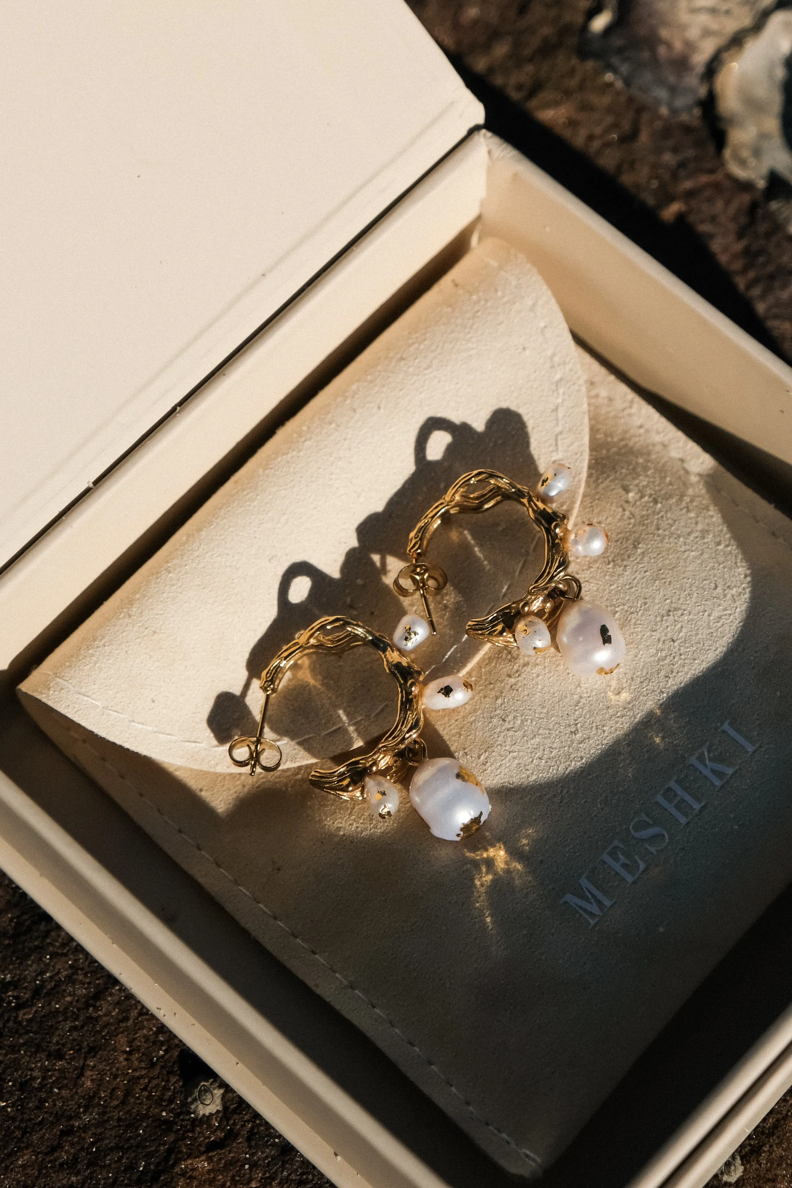 Nixie Pearl C Hoop Earrings - Pearl sold by Meshki