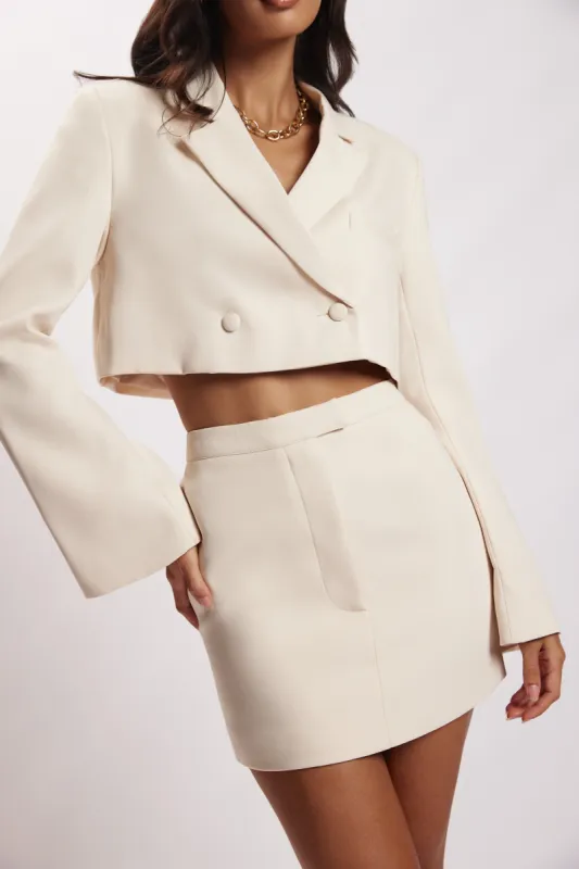 Josie Crepe Mini Skirt - Cream sold by Meshki