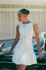 Mackenzie Sleeveless Pleated Mini Dress - Ivory sold by Meshki