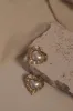 Heart To Heart Pearl Earrings - Gold sold by Meshki