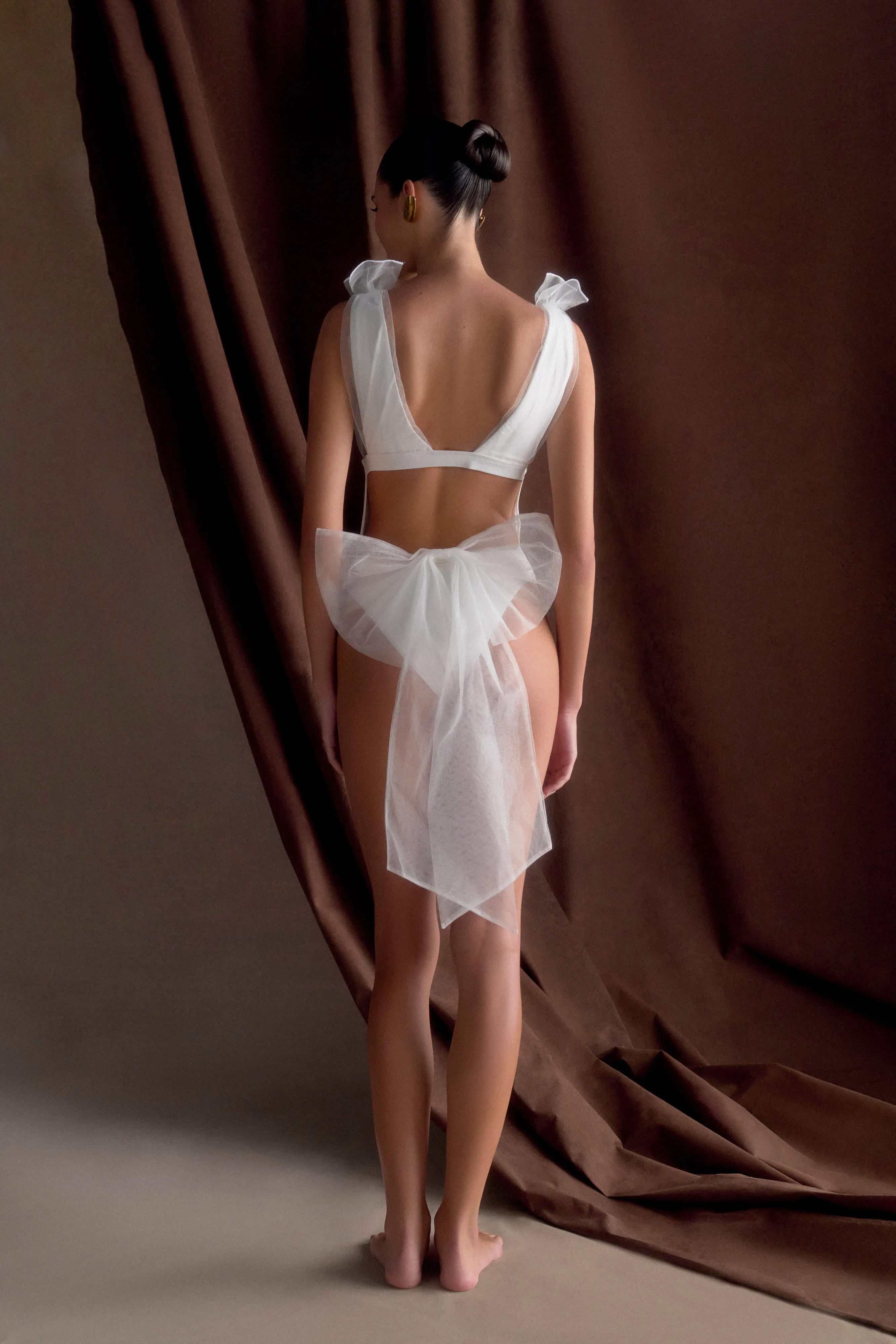 Sybil Plunge One Piece With Bow - Ivory sold by Meshki