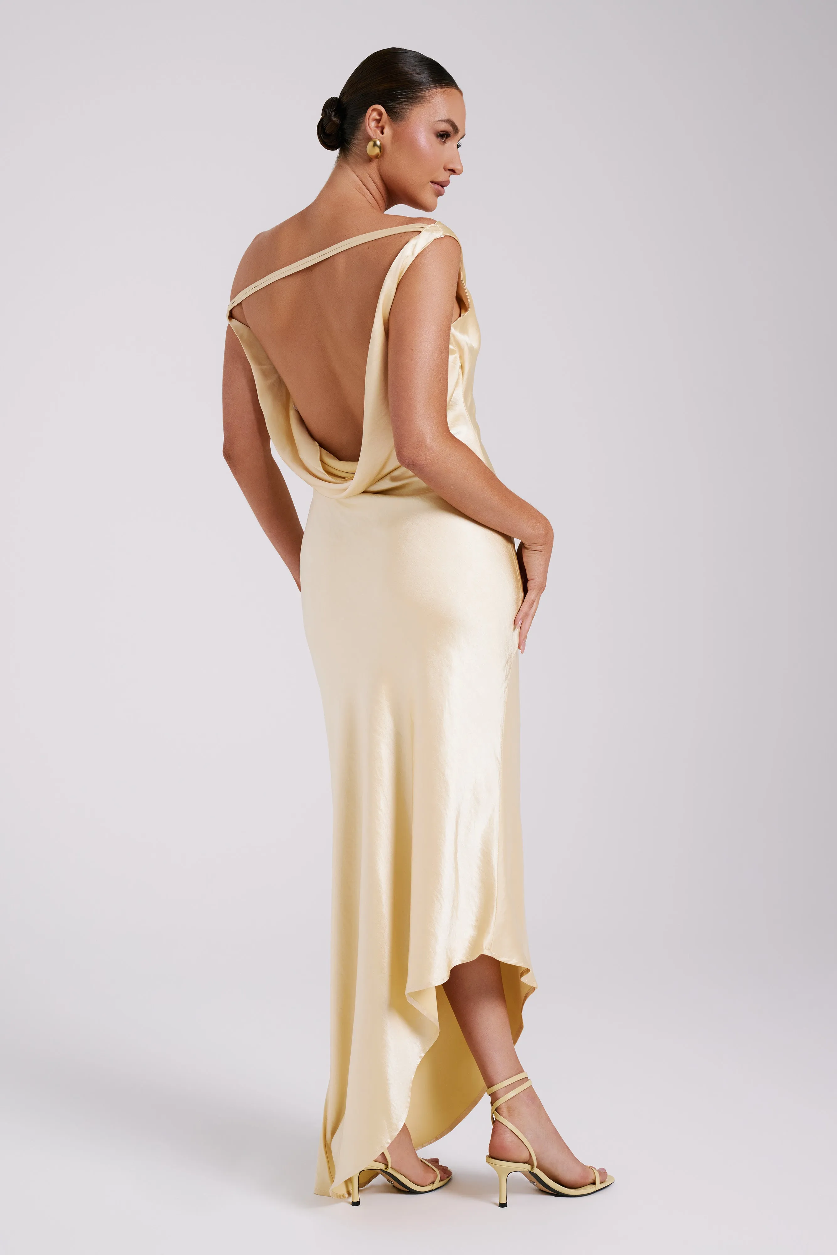 Yvette Slip Maxi Dress With Asymmetrical Hem - Butter sold by Meshki