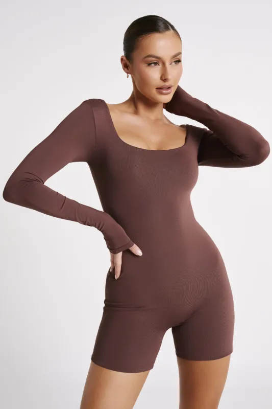 Oakley Recycled Nylon Long Sleeve Playsuit - Mocha sold by Meshki
