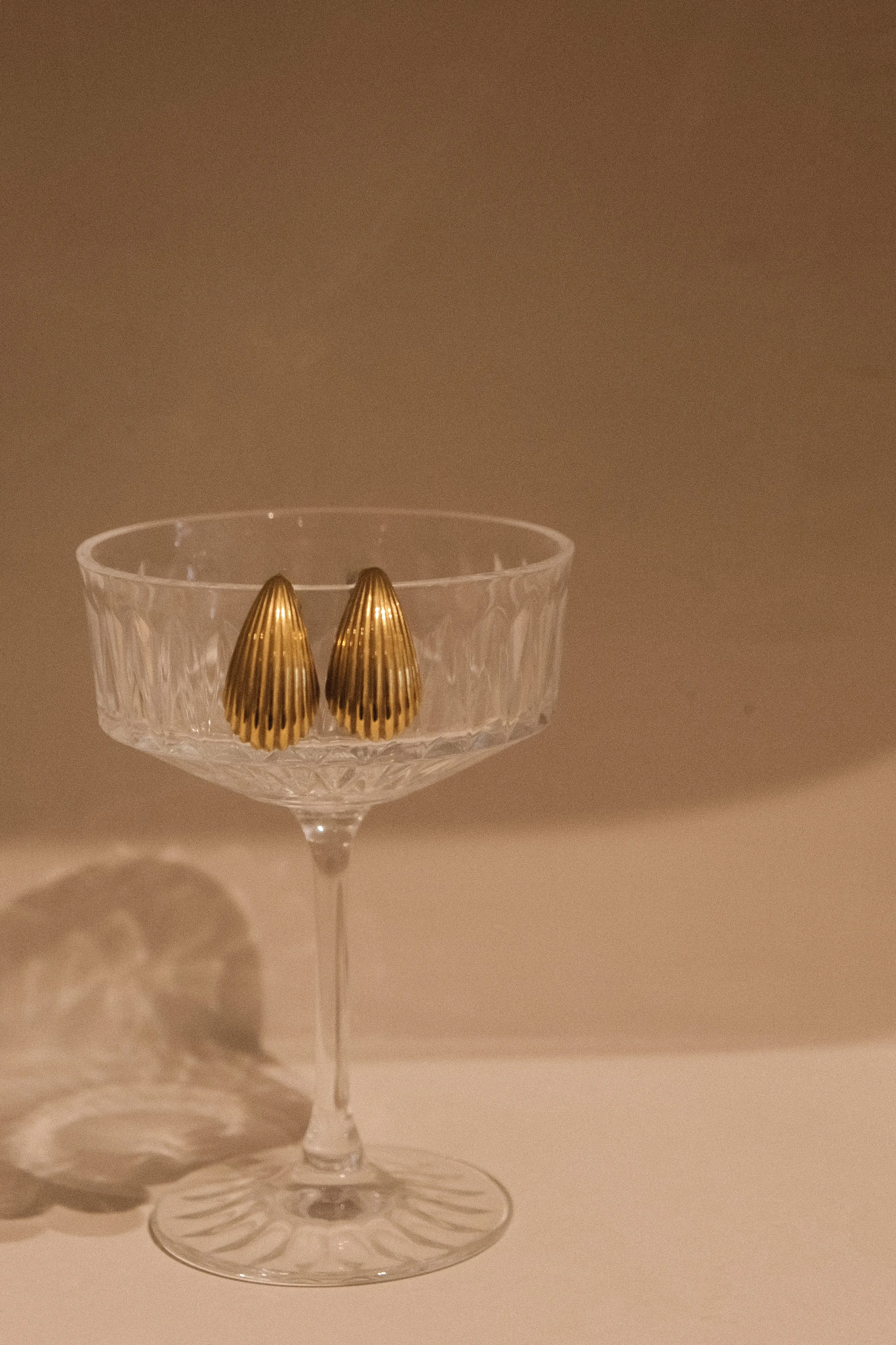 Sloane C Shape Hoop Earrings - Gold sold by Meshki