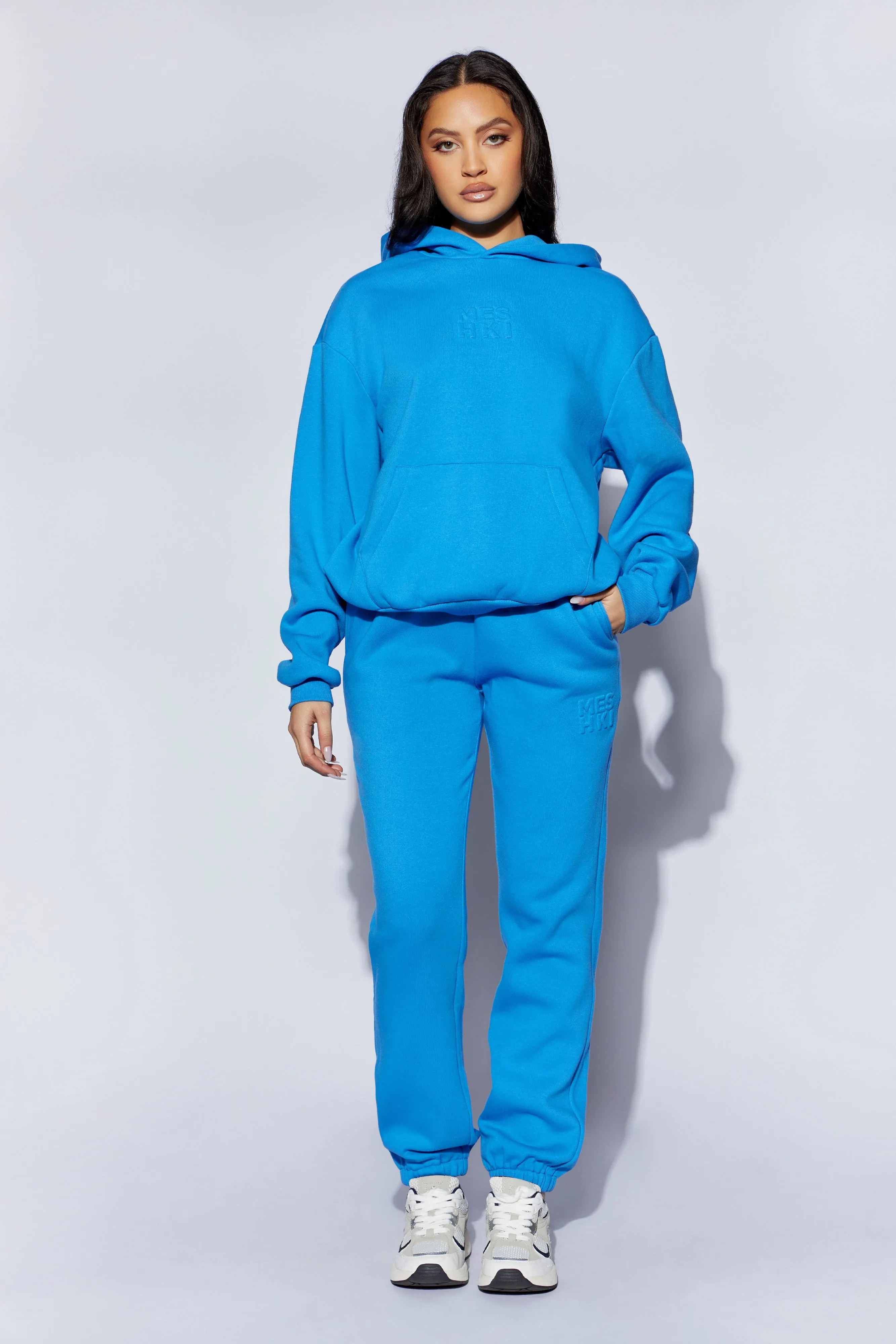 Emery Embossed Fleeceback Joggers - Blue sold by Meshki