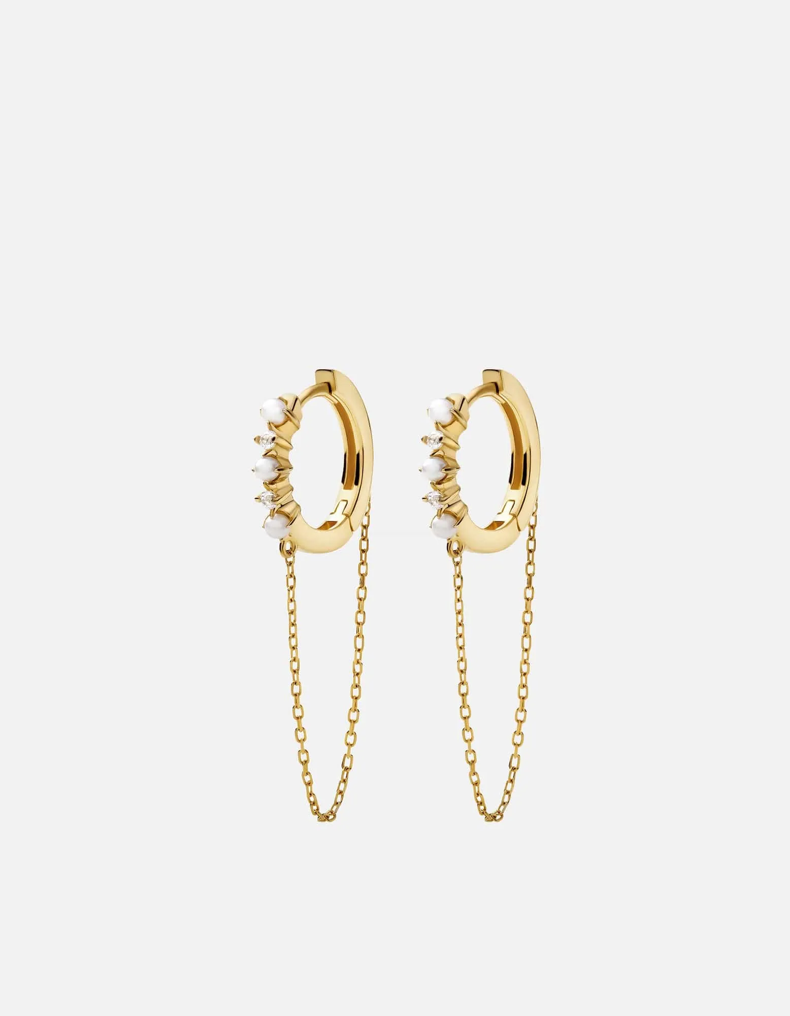 Calista Huggie Pearl Earrings, 14k Gold Pavé sold by Miansai