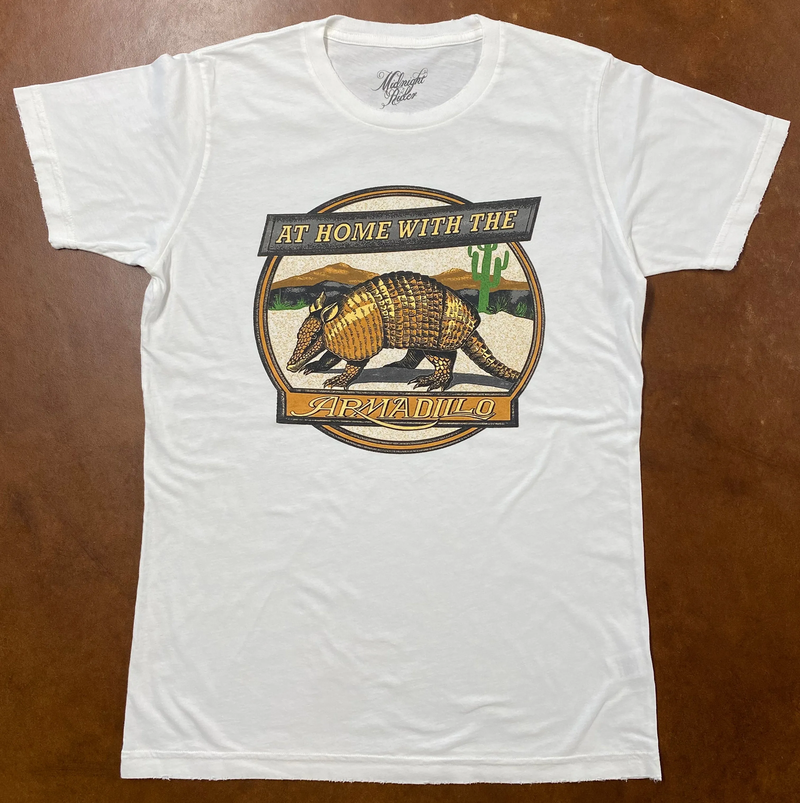 At Home with the Armadillo Unisex Tee sold by Midnight Rider