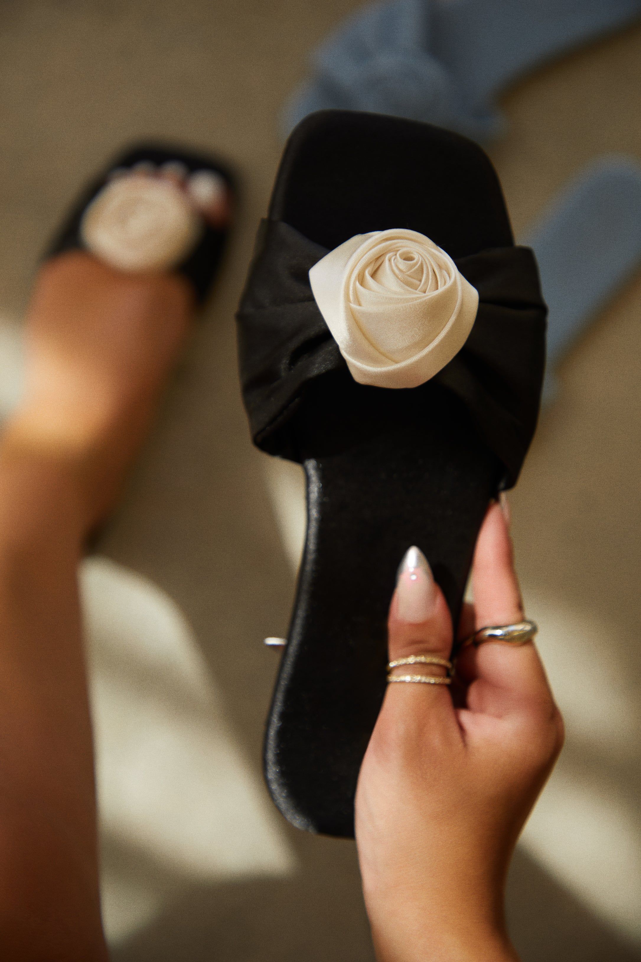 Roselin Rosette Slip On Sandals - Black sold by Miss Lola