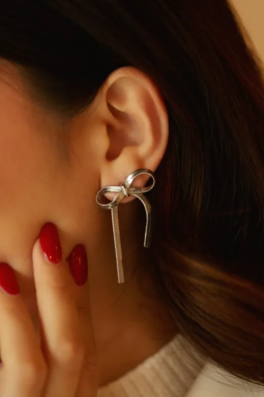 Cari Bow Tie Statement Earring - Silver sold by Miss Lola
