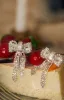 Picture Perfect Embellished Bow Tie Earring - Silver sold by Miss Lola