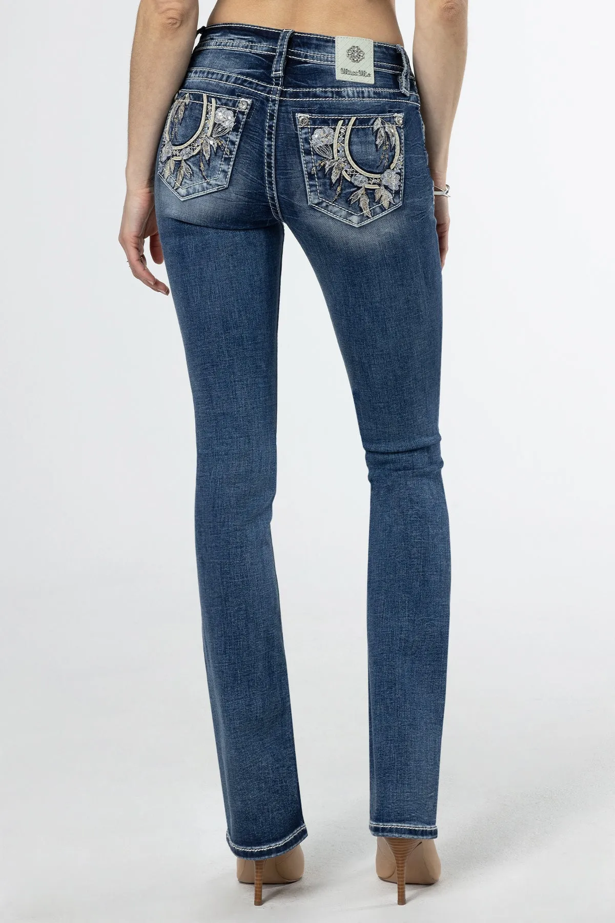 Floral Feathers Bootcut Jeans sold by Miss Me