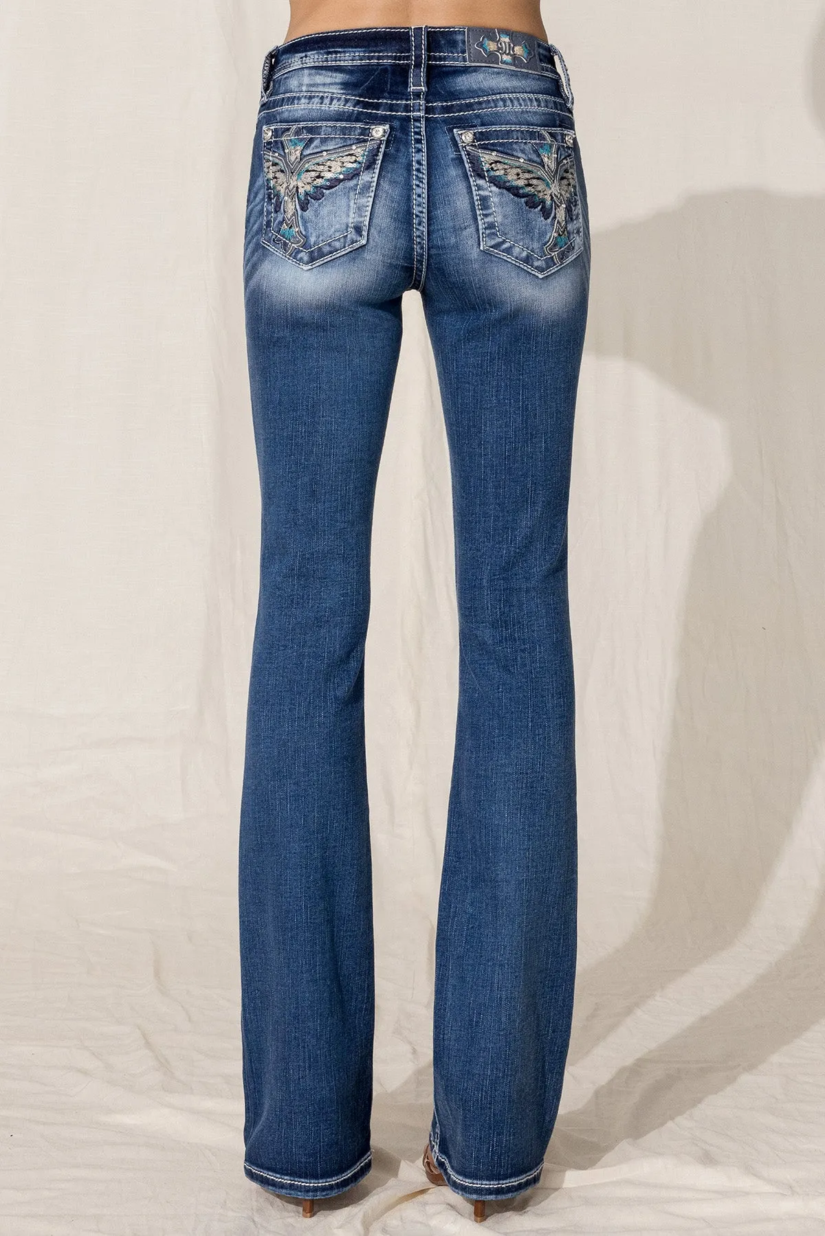 Icelandic Cross Bootcut Jeans sold by Miss Me