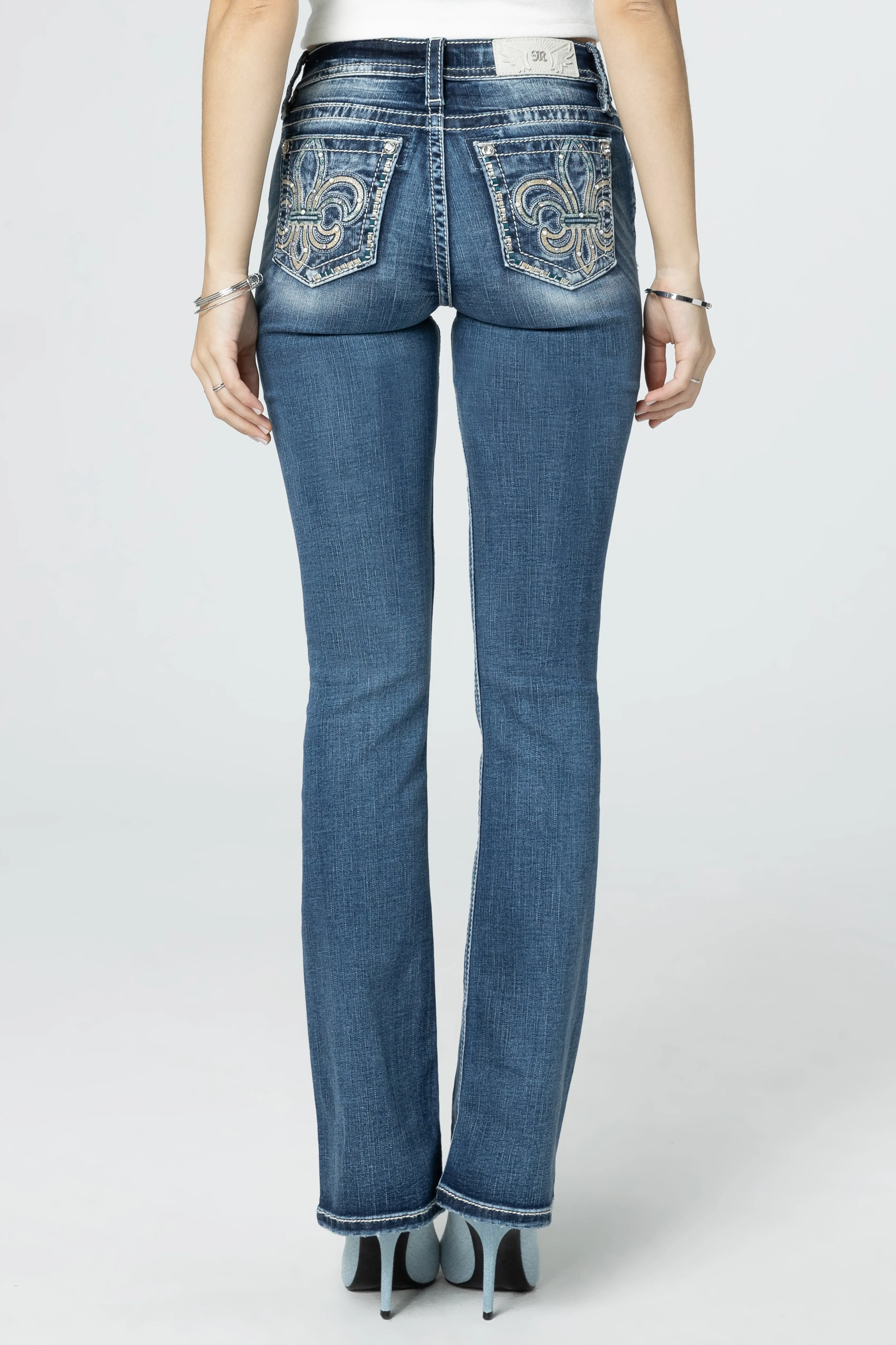 Turquoise & Champagne Fleur De Lis Bootcut Jeans sold by Miss Me