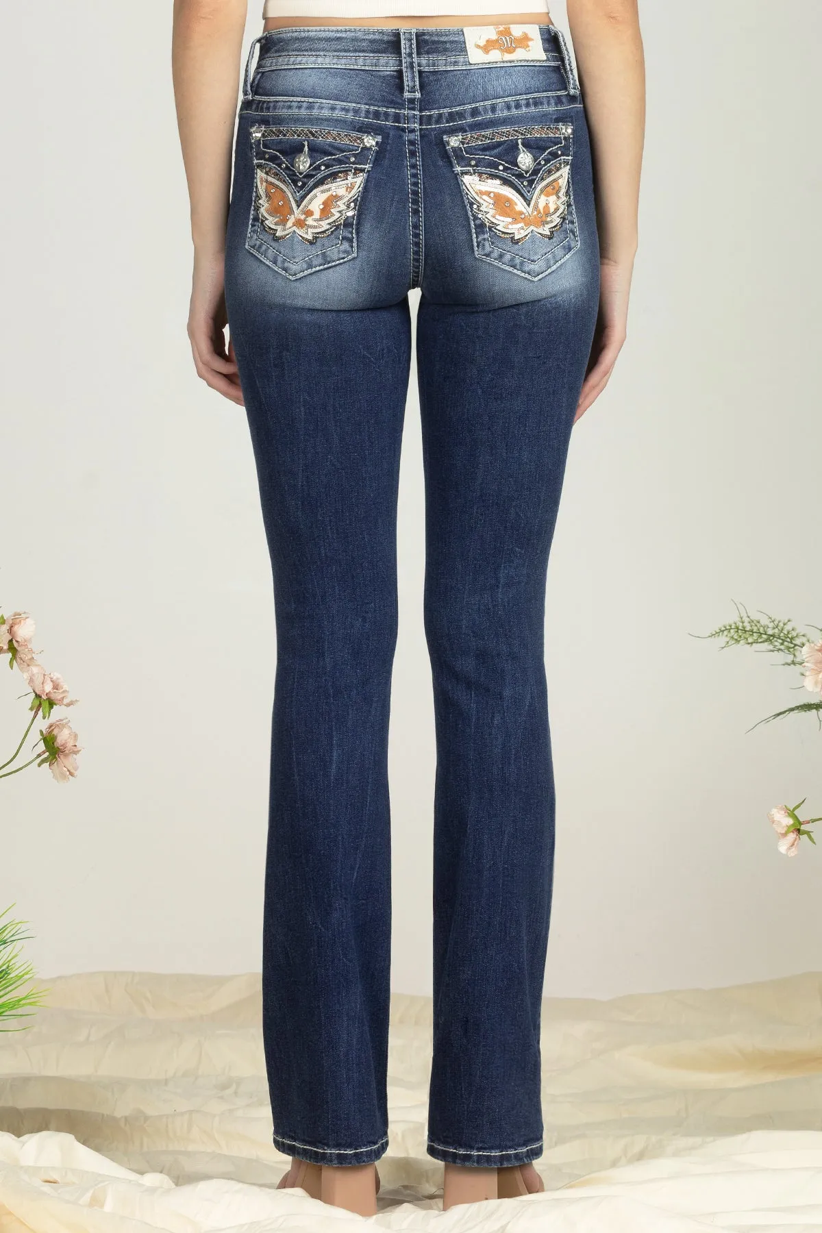 Cow Print Wing Denim sold by Miss Me