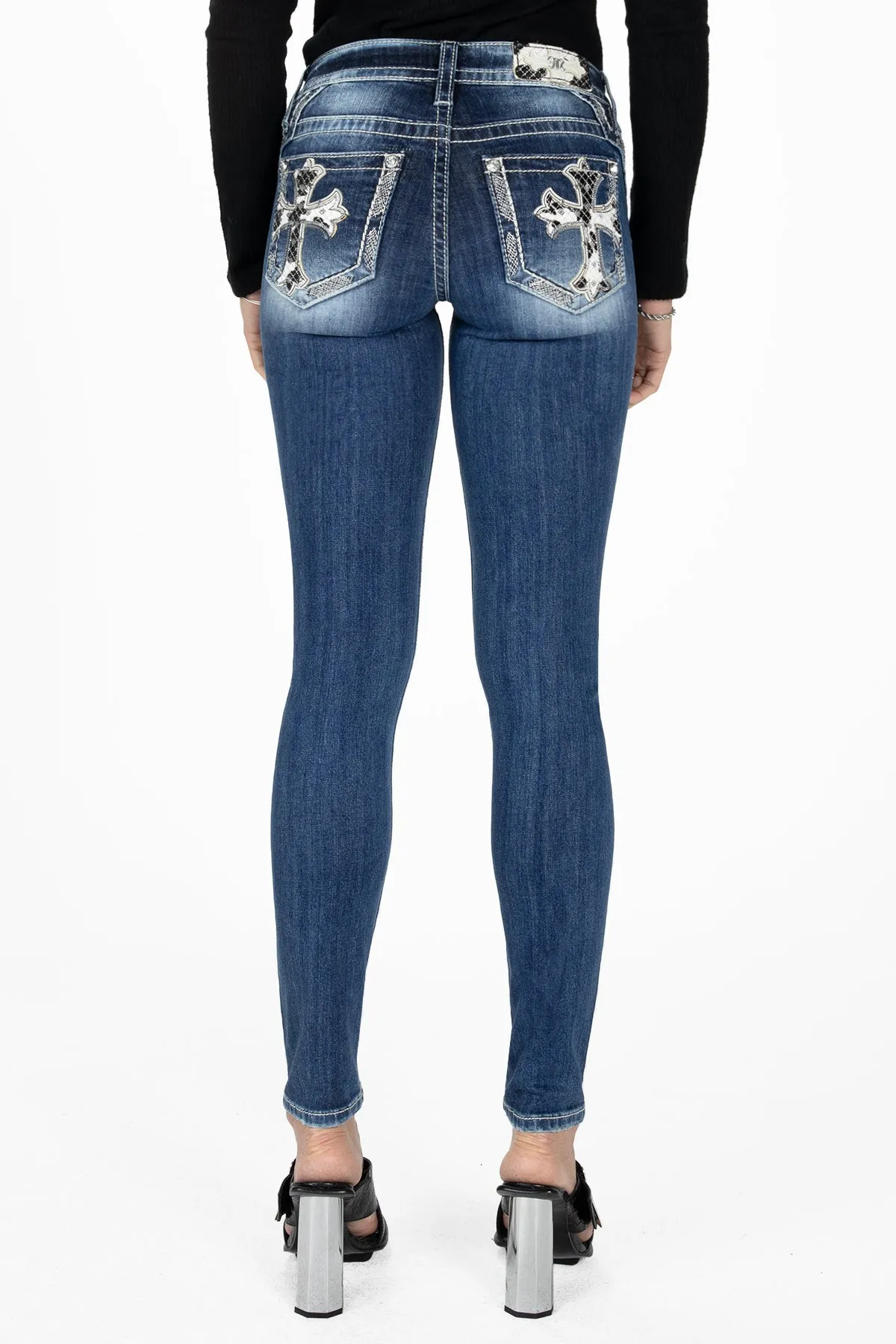 Cow Print Cross Skinny Jeans sold by Miss Me