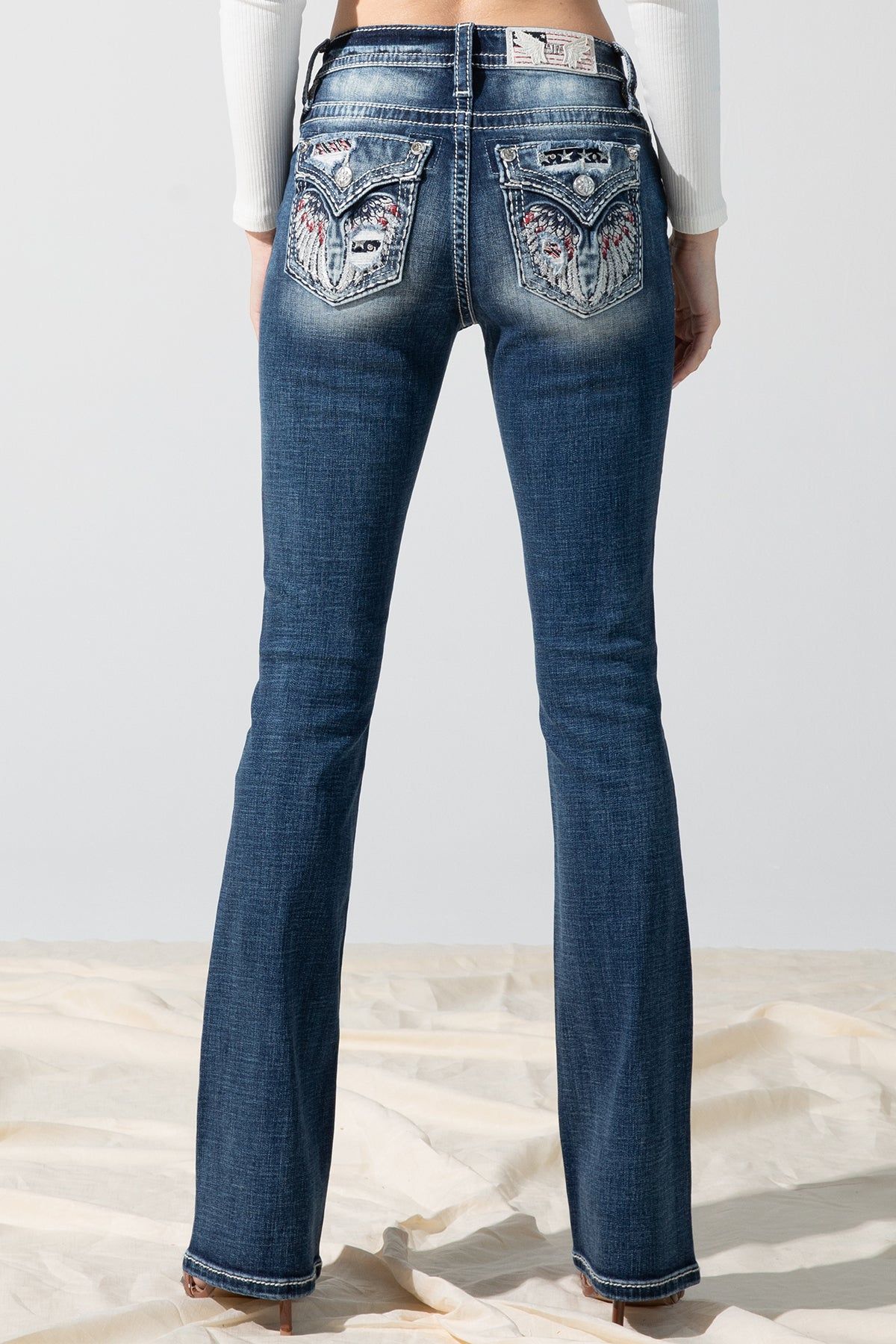 Winged Allegiance Bootcut Jeans sold by Miss Me