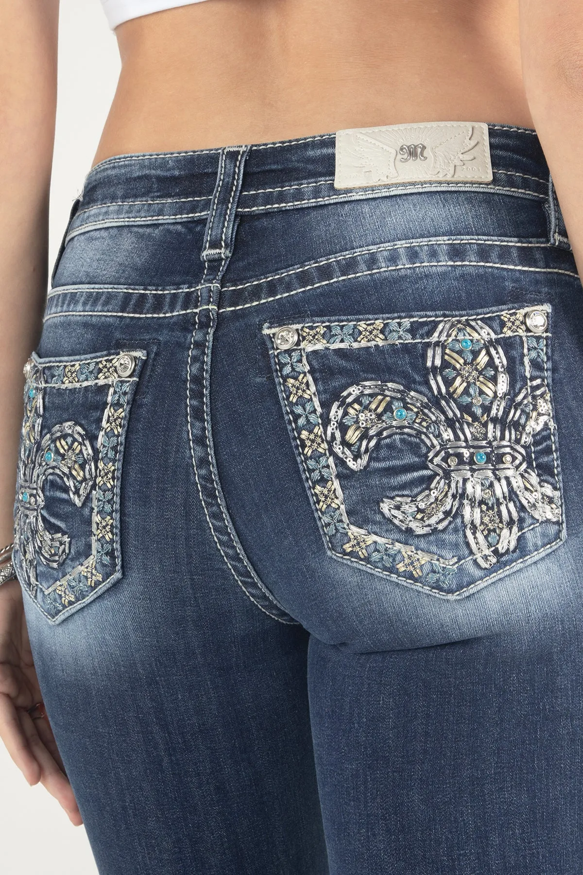Metallic Turquoise Fleur De Lis Bootcut Jeans sold by Miss Me