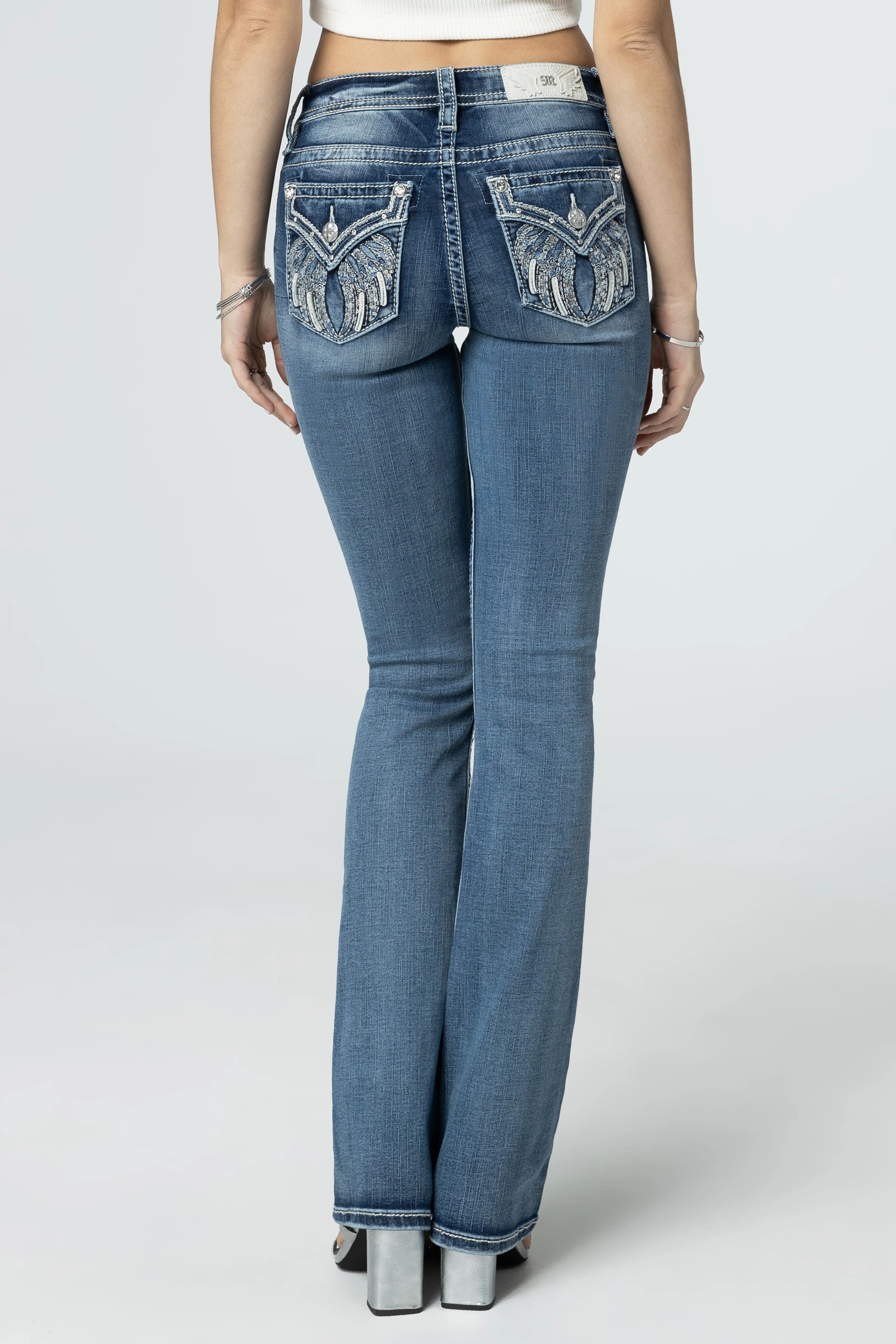 Silver Angel Down Wings Bootcut Jeans sold by Miss Me