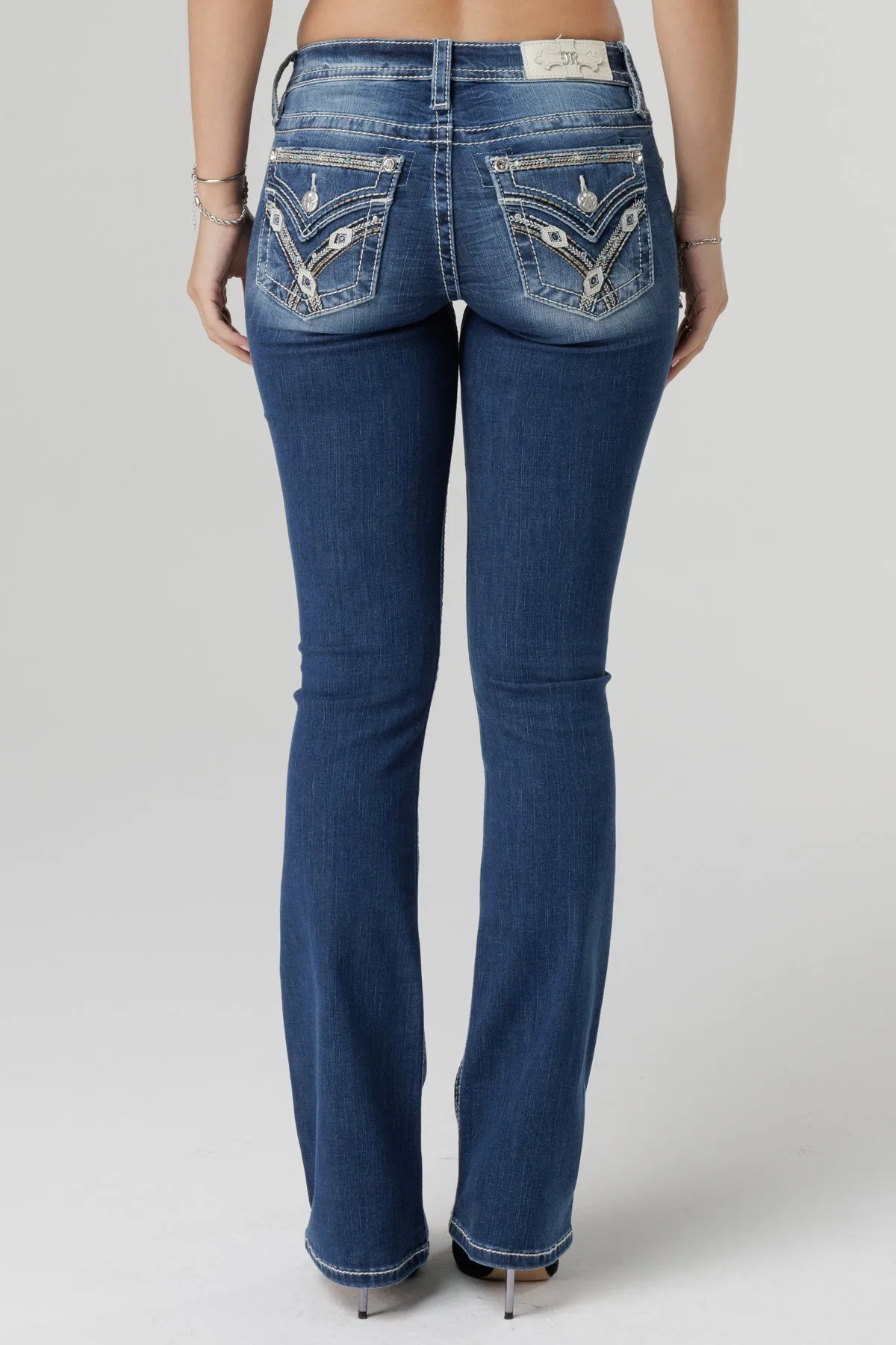 Stitched and Jaded Bootcut Jeans sold by Miss Me