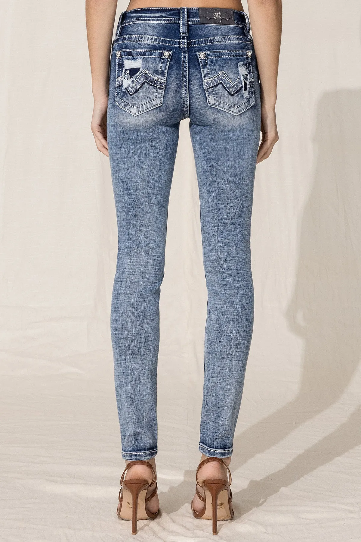 Modern Blowout Logo Skinny Jeans sold by Miss Me