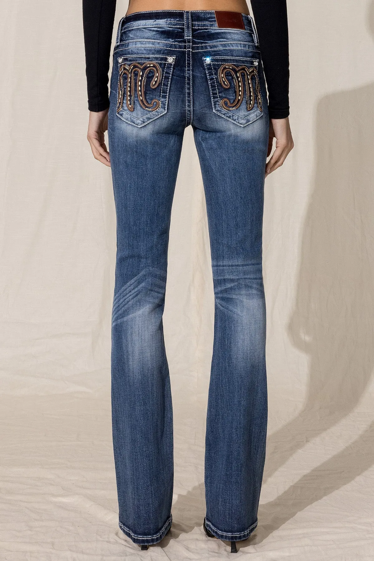 A Classic M Bootcut Jeans sold by Miss Me