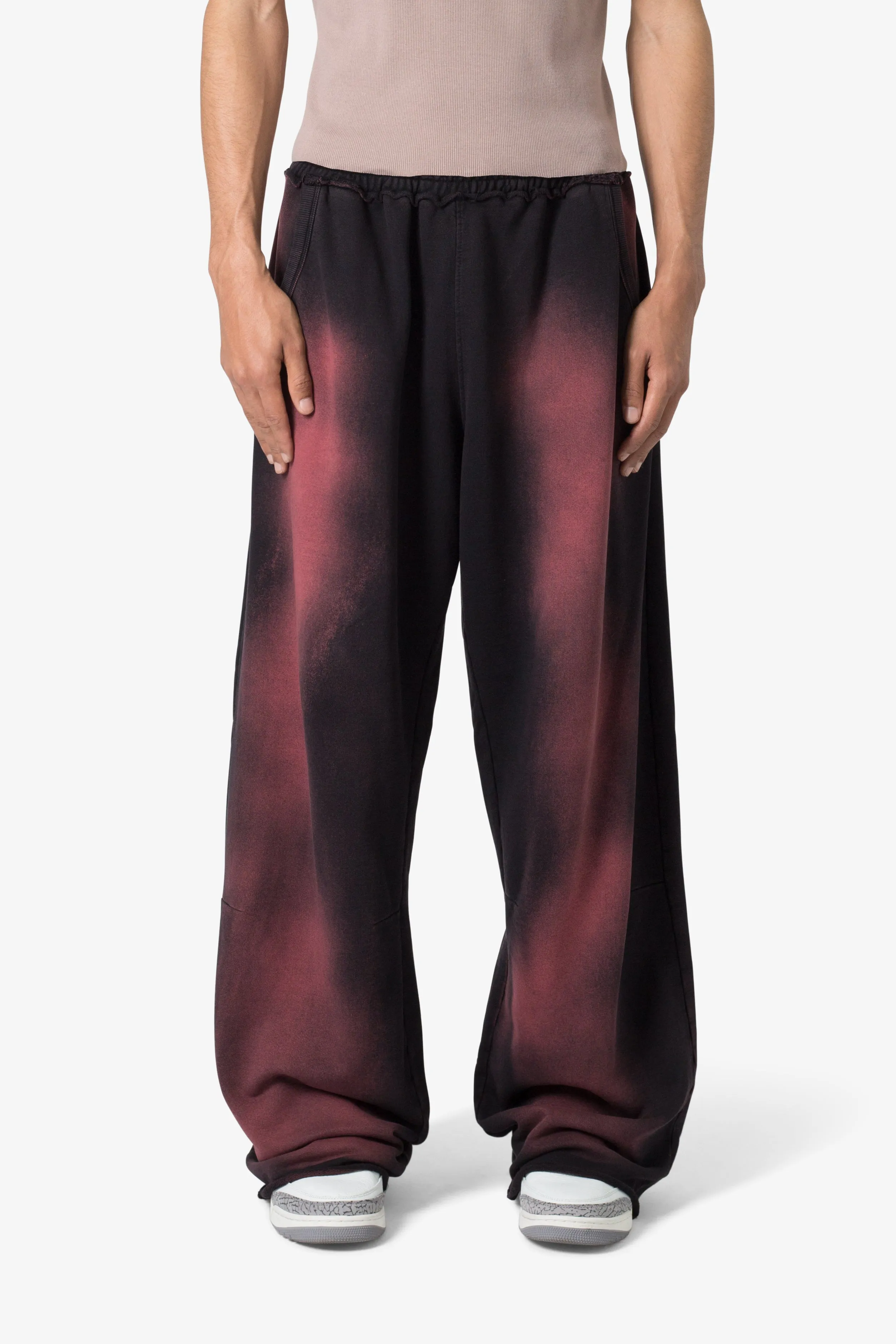 Sprayed Ultra Baggy Sweatpants - Black/Red sold by MNML