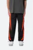 Striped Track Pants - Black/Orange sold by MNML