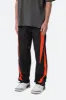 Striped Track Pants - Black/Orange sold by MNML