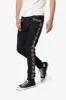 X620 Studded Skinny Denim - Black sold by MNML