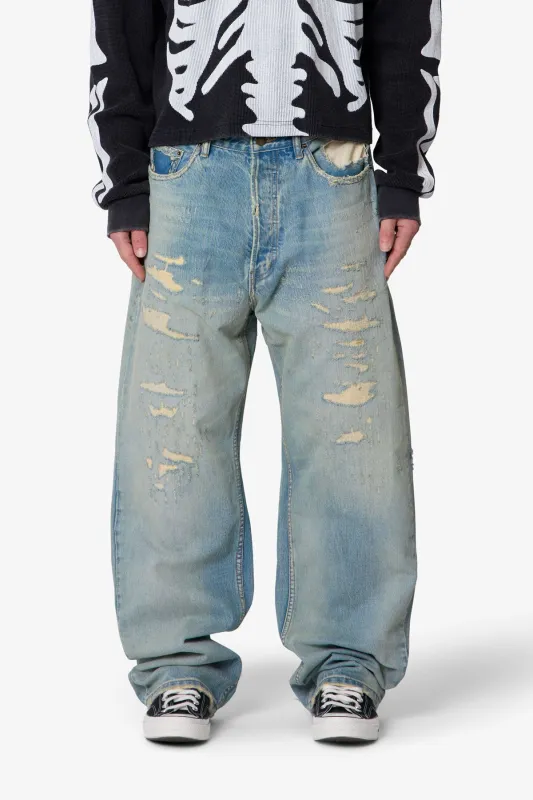 Distressed Ultra Baggy Denim - Blue sold by MNML