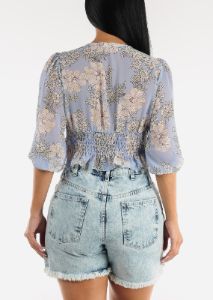Front Knot Ruffle Hem Floral Crop Top Blue sold by Moda