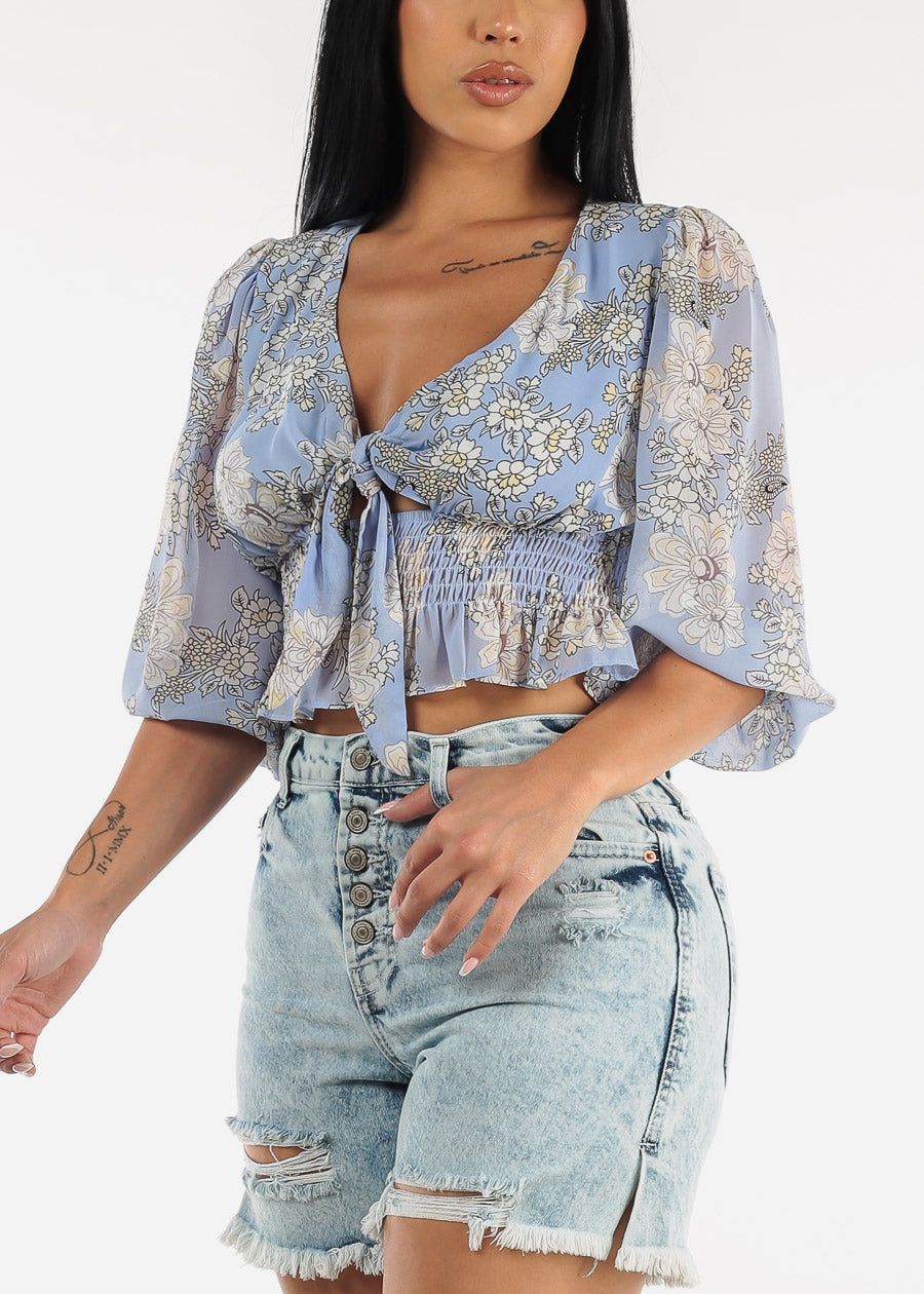Front Knot Ruffle Hem Floral Crop Top Blue sold by Moda