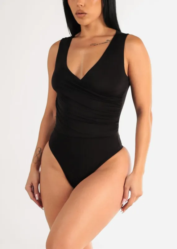 Black Sleeveless Surplice Thong Bodysuit sold by Moda