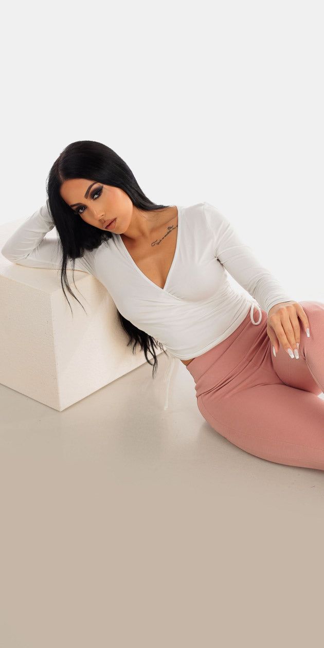 Mauve Butt Lifting Skinny Pants with White Ruched Long Sleeve Surplice Crop Top sold by Moda